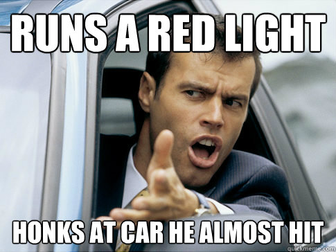 runs a red light honks at car he almost hit - Asshole driver