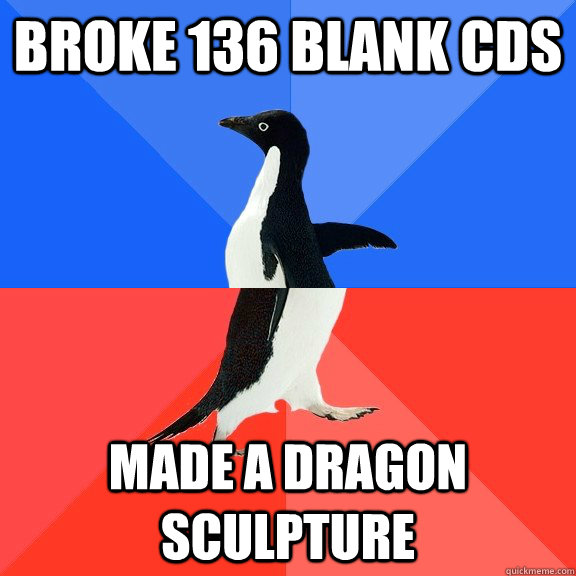 broke 136 blank cds made a dragon sculpture - Socially Awkward Awesome Penguin