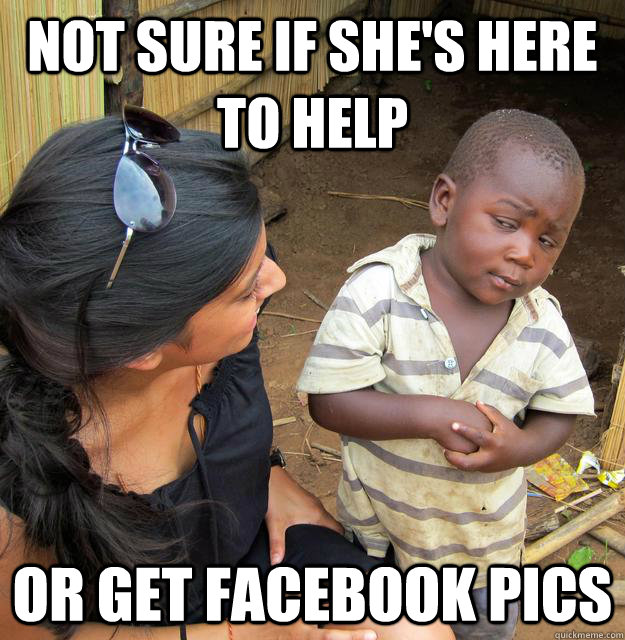 not sure if shes here to help or get facebook pics - Skeptical Third World Child