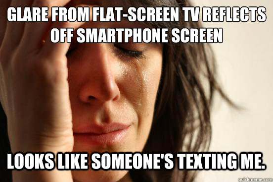 glare from flatscreen tv reflects off smartphone screen loo - First World Problems