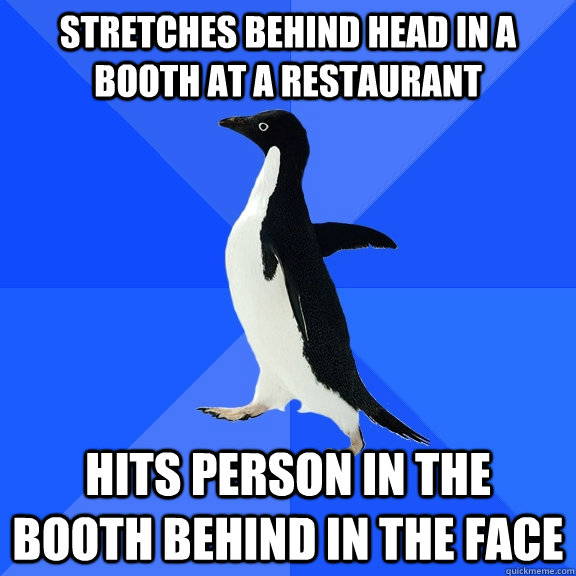 stretches behind head in a booth at a restaurant hits pers - Socially Awkward Penguin