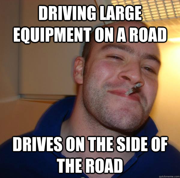 driving large equipment on a road drives on the side of the - Good Guy Greg