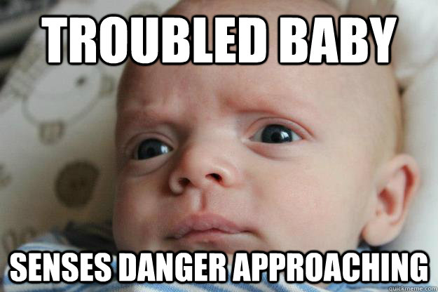 troubled baby senses danger approaching - troubled baby