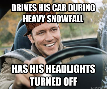 drives his car during heavy snowfall has his headlights turn - SCUMBAG DRIVER