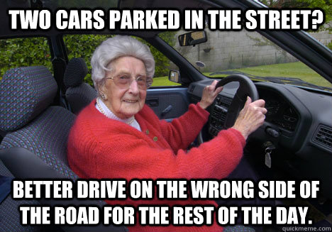 two cars parked in the street better drive on the wrong sid - Bad Driver Barbara